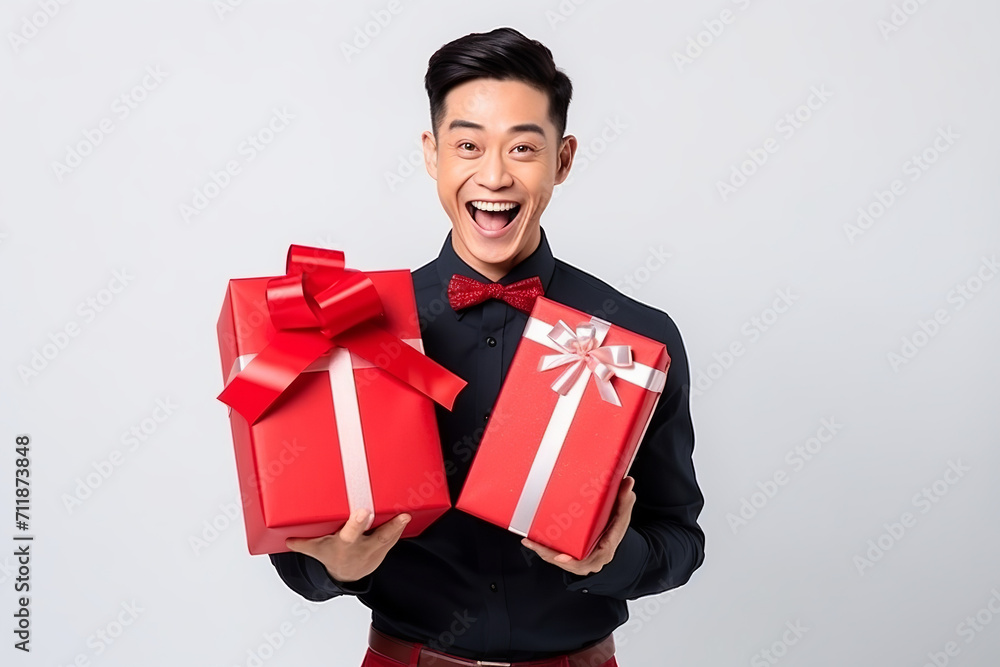 happy handsome asian man holds red and pink gift box, valentine's day on white happy handsome asian man holds red and pink gift box, valentine's day on white