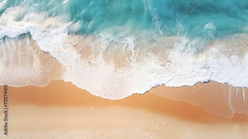 Top down view of ocean waves gently rolling onto the beach