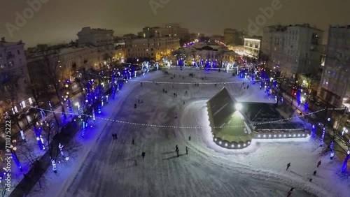 Ice rink with people on Chistye Prudi in Moscow at winter photo