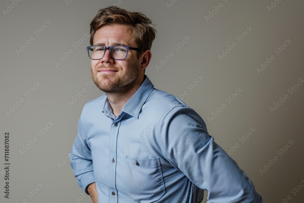 A man with back pain, painful sensations in the lower back. Background with selective focus and copy space A man with back pain, painful sensations in the lower back. Background with selective focus and copy space