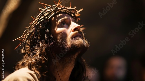 Jesus Christ with crown of thorns looking at the sky with a crucified sad face HD
