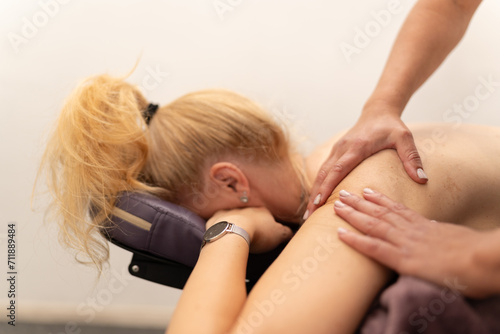 Obraz na płótnie Concentrated Back Massage by Professional Masseuse w salonie