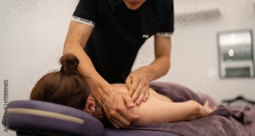 Obraz na płótnie Concentrated Back Massage by Professional Masseuse w salonie