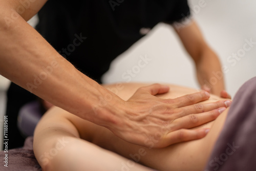 Obraz na płótnie Concentrated Back Massage by Professional Masseuse w salonie