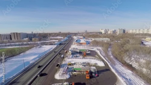 Road traffic near snow-smeltery and emergency control reservoir photo