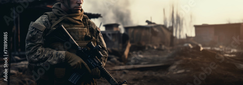 Close-up portrait of a soldier with a weapon during a military operation photo