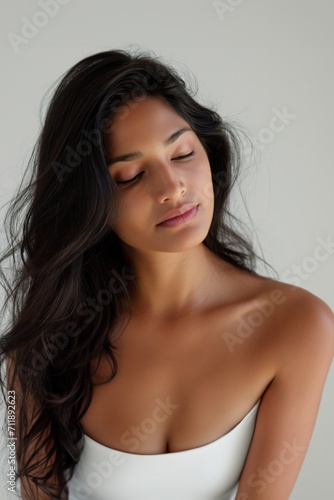 Wallpaper Mural Beautiful young Indian woman takes care of her skin, posing over grey background Torontodigital.ca