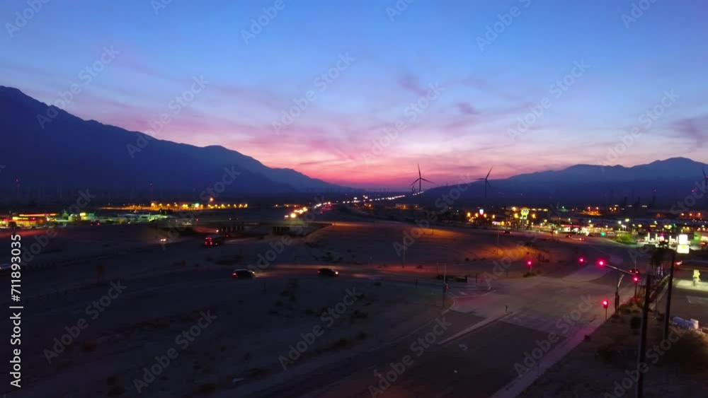 Aerial Scenic View Of Illuminated Landscape By Mountains, Drone Flying Upwards During Dusk - Palm Springs, California Aerial Scenic View Of Illuminated Landscape By Mountains, Drone Flying Upwards During Dusk - Palm Springs, California