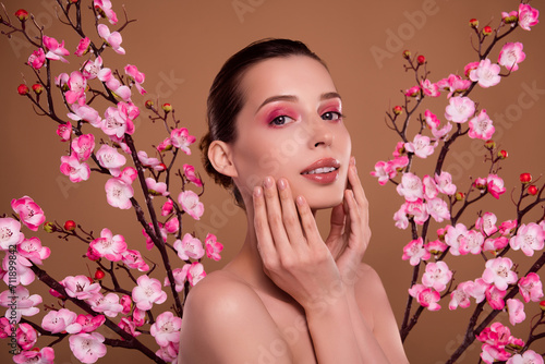 Fototapeta Naklejka Na Ścianę i Meble -  Photo of gorgeous stunning lady touch apply japan traditional beauty product soft body over cherry tree garden