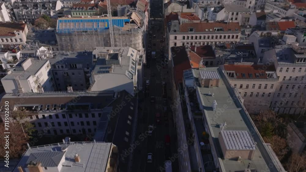 custom made wallpaper toronto digitalHigh angle view of vehicles driving on street lined by multilevel town development. Tilt up reveal cityscape. Vienna, Austria