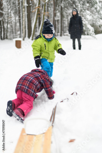 Kids Falling Down From Sledge in Winter Park