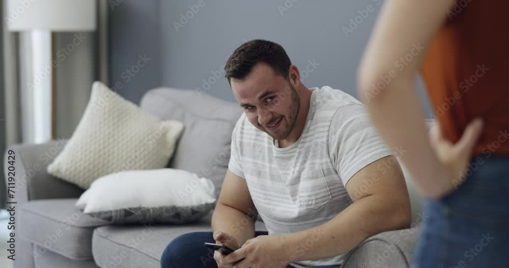Infidelity, couple and caught cheating on phone with fight, conflict or argument about social media. Divorce, breakup or affair with man and woman on sofa in home living room for online communication Infidelity, couple and caught cheating on phone with fight, conflict or argument about social media. Divorce, breakup or affair with man and woman on sofa in home living room for online communication