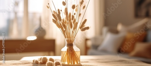 Vase with dried flowers on table in room, closeup. Interior design photo