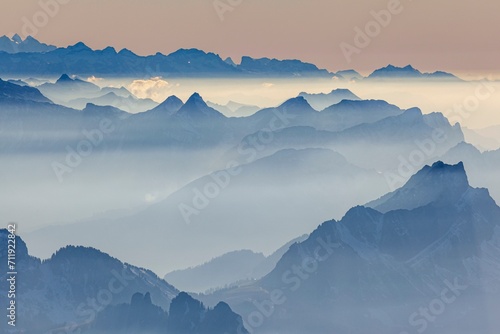 View of mountain range, haze, backlight, autumn, view from Saentis to the Bernese Alps, Appenzell, Switzerland, Europe photo