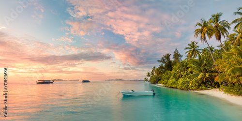 Panoramic of island and beach in the Maldives at sunset