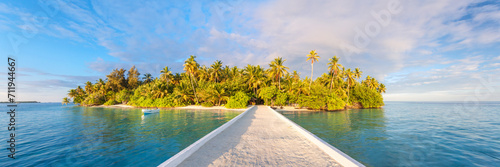 Panoramic of jetty leading to tropical island in the Maldives photo