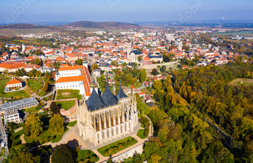 Panoramic view from drone of Czech town of Kutna Hora overlooking medieval Jesuit College and St. Barbara Cathedral on sunny autumn day, Central Bohemian Region..