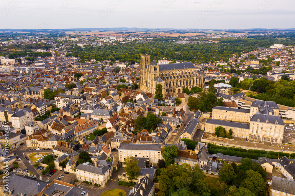 Scenic aerial view of Bourges town and surroundings in summer overlooking Gothic building of Roman Catholic Cathedral, France..