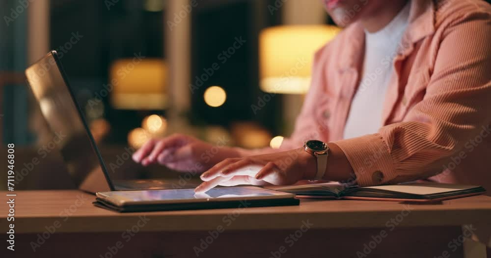 Hands, laptop and tablet at night for work from home research, multimedia planning or social media in bokeh. Person or freelancer closeup with scroll on digital technology and computer for website Hands, laptop and tablet at night for work from home research, multimedia planning or social media in bokeh. Person or freelancer closeup with scroll on digital technology and computer for website