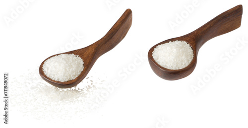 Shredded coconut in the wooden spoon, isolated on white background. photo