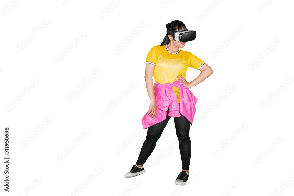 Young woman dancing with a virtual reality headset in the studio Young woman dancing with a virtual reality headset in the studio