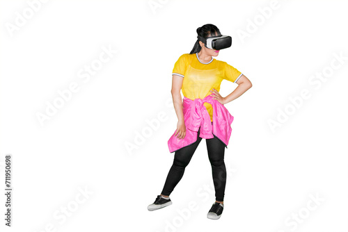 Young woman dancing with a virtual reality headset in the studio © Creativa Images