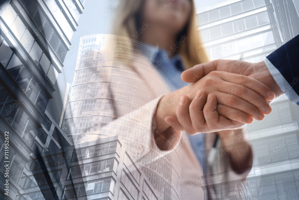 Partnership, cooperation, collaboration. Double exposure of buildings and people shaking hands Partnership, cooperation, collaboration. Double exposure of buildings and people shaking hands
