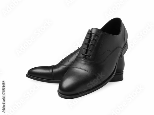 Pair of black leather men shoes isolated on white