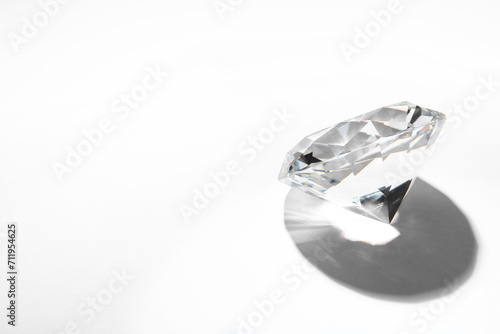 One beautiful shiny diamond on white background, space for text