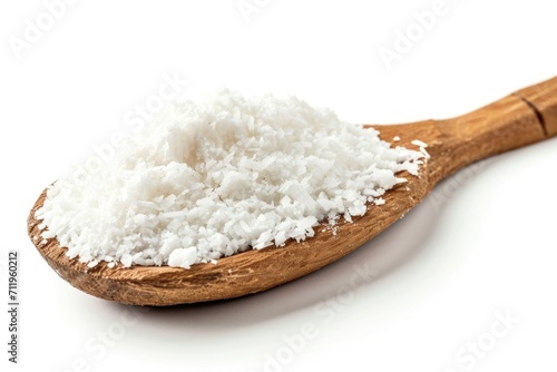 Coconut flakes in wooden spoon