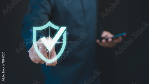 Foto Customer hand touch the identity proof icon for security protection system on virtual screen