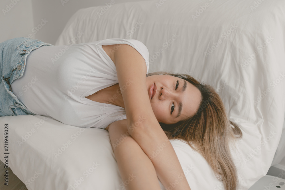 Single beautiful asian woman feeling lonely, lying alone in the room with tear. Single beautiful asian woman feeling lonely, lying alone in the room with tear.