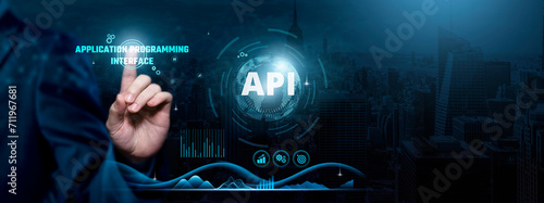 API Integration, Seamless Connectivity, Cutting-edge Solutions, Businessman touch API-related text on the global network cyberspace, technology, and innovation concept. photo
