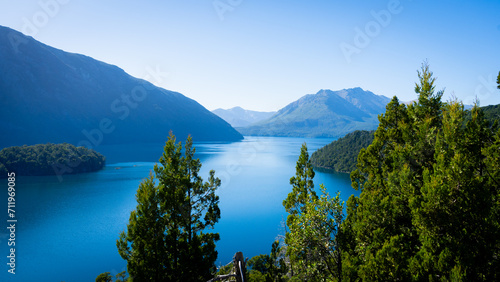 mountain with blue lake and green trees
