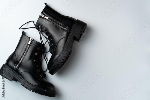 Black boots on a white background. Copy space