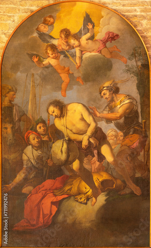 VICENZA, ITALY - NOVEMBER 6, 2023: The painting of Martyrdom of St. Florian in Basilica dei Santi Felice e Fortunato by unknown artist.