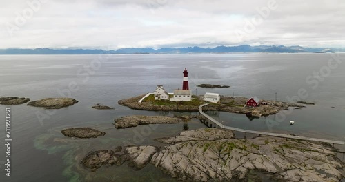 Footbridge To The Tranoy Lighthouse (Tranoy Fyr) By The Sea In Hamaroy, Nordland, Norway. - aerial shot photo