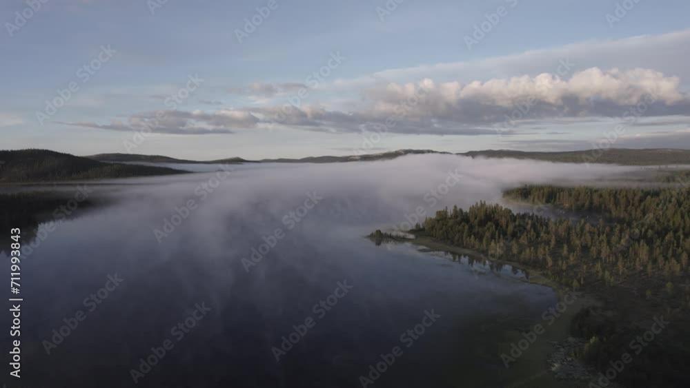Morning fog over tranquil lake reflects forest Norwegian landscape DRONE Morning fog over tranquil lake reflects forest Norwegian landscape DRONE