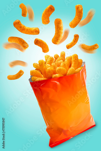 Puffed corn snacks cheesy chips fly out of plastic snack bags isolated on blue background, Puff corn or Corn puffs cheese flavor on blue, With clipping path.