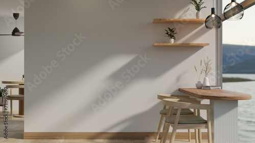 Fototapeta Naklejka Na Ścianę i Meble -  A modern, minimal cafe or restaurant with a minimal dining table near the large glass window.