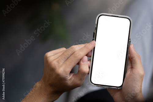 Close-up image of a man using his smartphone outdoors. A white-screen smartphone mockup.