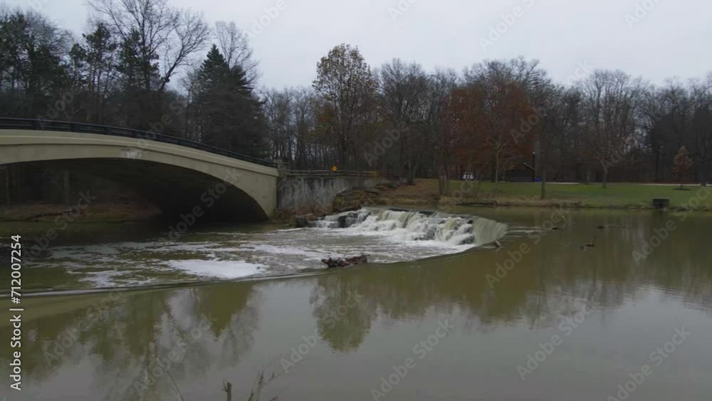 Berea, Ohio Metroparks pan shot of small waterfall and pedestrian bridge. Berea, Ohio Metroparks pan shot of small waterfall and pedestrian bridge.