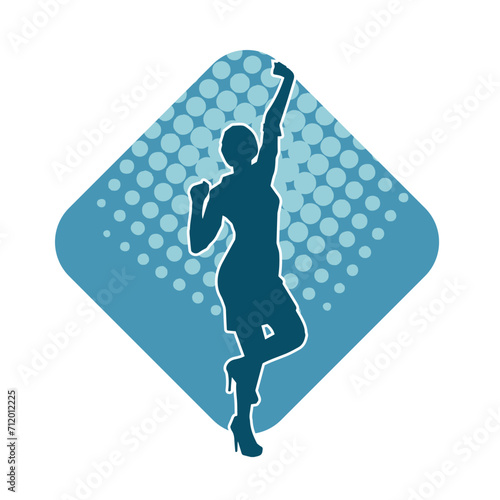 Silhouette of a female dancer in action pose. Silhouette of a woman dancing happily.