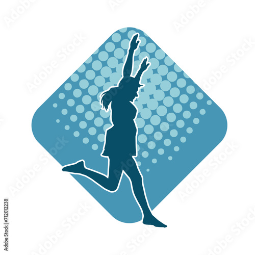 Silhouette of a female dancer in action pose. Silhouette of a woman dancing happily.