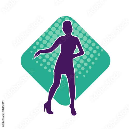 Silhouette of a slim female in dance pose. Silhouette of a woman dancing.