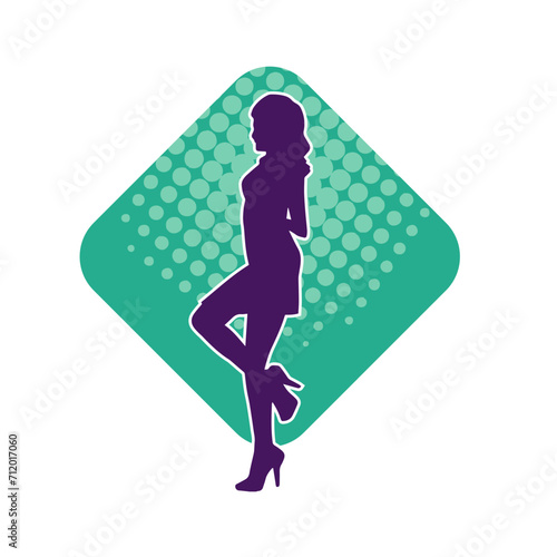 Silhouette of a slim female in dance pose. Silhouette of a woman dancing.