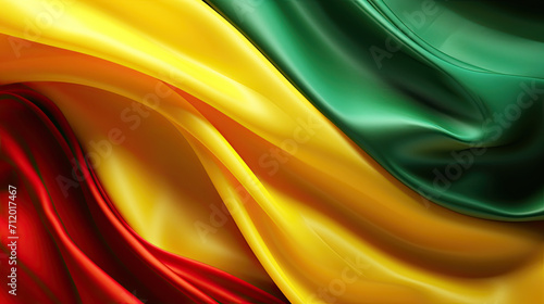 Abstract Colorful Silk Wave Fabric in Green, Yellow, and Red colors. Black History Month Concept Background