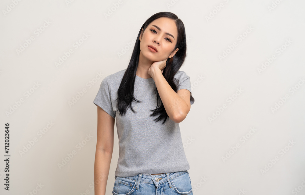 Asian woman has problem with structural posture She had neck and shoulder pain. She massaged her neck and shoulders for relief. reduce muscle tension. Unwell unhealthy on isolated white background Asian woman has problem with structural posture She had neck and shoulder pain. She massaged her neck and shoulders for relief. reduce muscle tension. Unwell unhealthy on isolated white background
