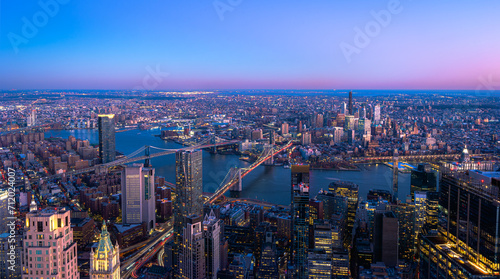Skyline of Manhattan New York City during the night.View of Brooklyn and Manhattan Bridge over East River.