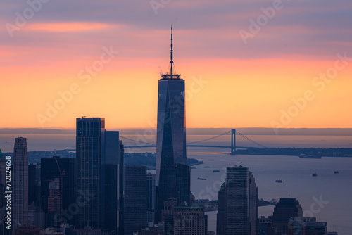 New York City Manhattan skyline with One World Trade Center Tower at sunset